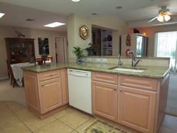 Granite counters and wood cabinetry are nice touches